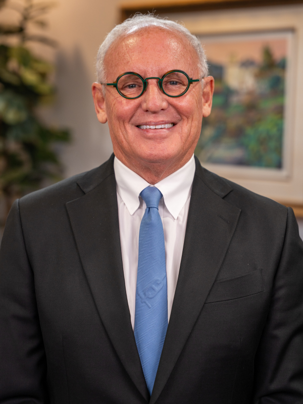 Portrait of Dr. Robert F. Murray, DDS, smiling in a professional dental office setting – robert f murray dds