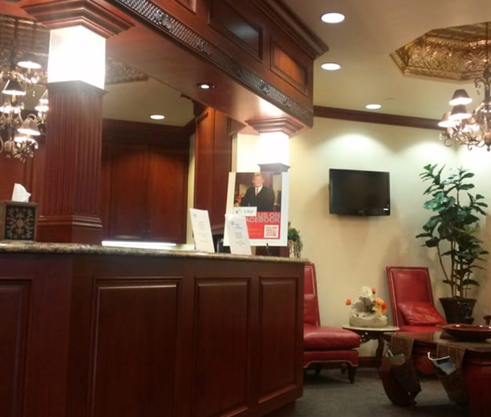 Reception area of Dr. Robert F. Murray, DDS – robert f murray dds Elegant dental office reception with wood paneling and comfortable seating at Dr. Robert F. Murray, DDS practice – robert f murray dds